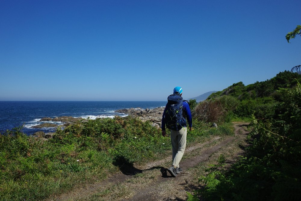 A walker on a coastal path